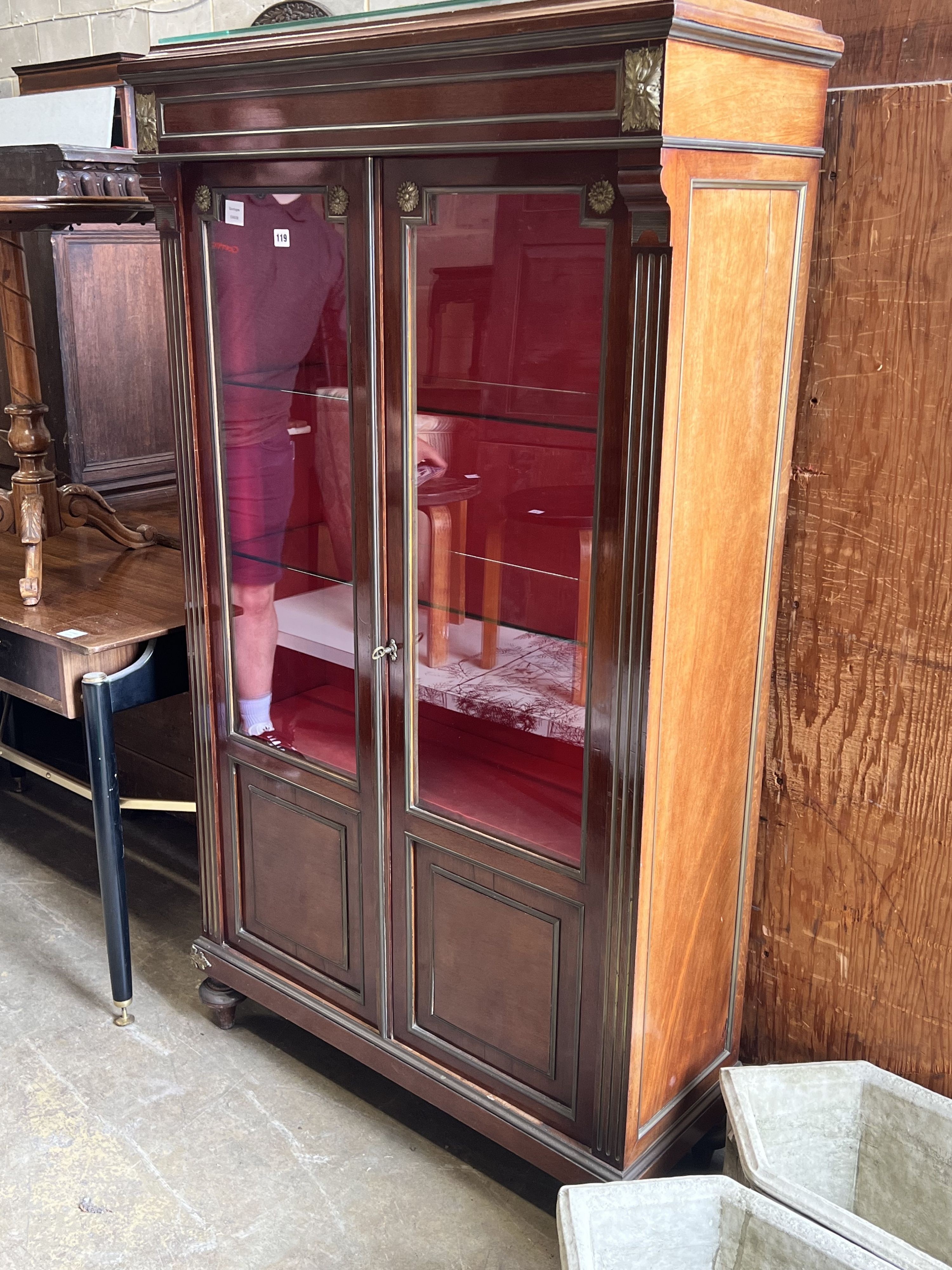 A late 19th century French gilt metal mounted mahogany vitrine, width 94cm depth 37cm height 165cm